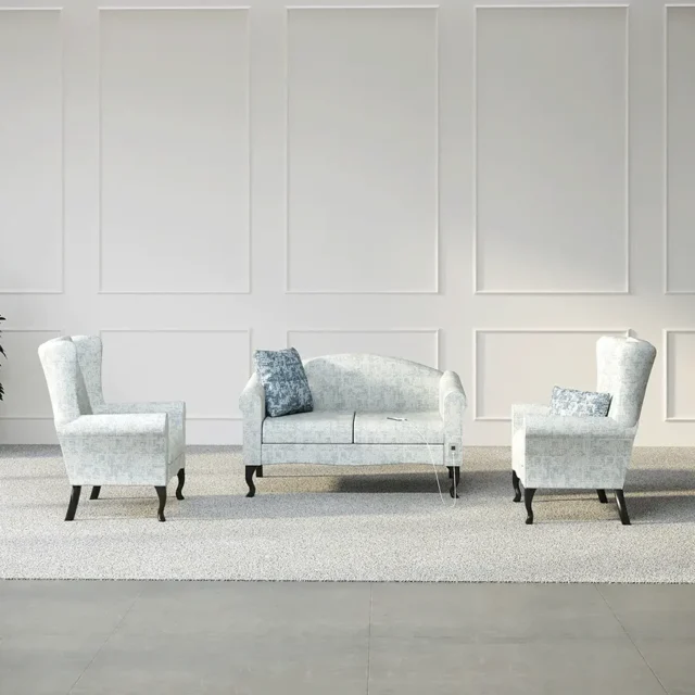 Seating configuration shows Flexxform Eli Senior Living seating with a floral fabric. A sofa and two lounge chairs with a pillow complete the configutaion.