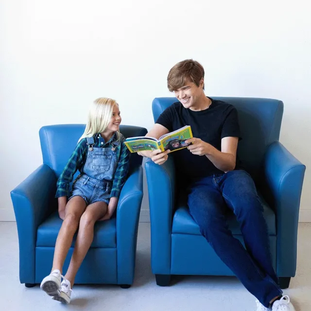 Image shows an adult and child / junior size of Flexxform Joy seating in a blue vinyl.