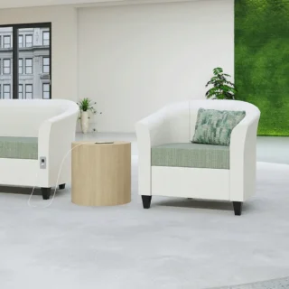 Image shows Flexxform Tub lounge chiar with White fabric frame and green fabric seat. Multi colored green pillow shown on seat.