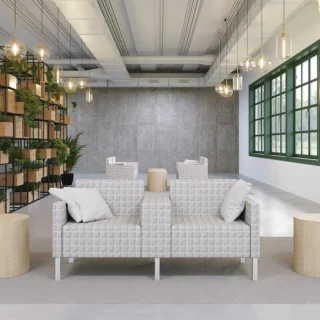 Flexxform Thk + Thn lounge seating with decorative fabric. Thick middle arm shows alternative seat or table top.