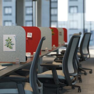 Modern office workspace with Ezobord Desk Return Screens providing sound absorption and privacy for individual workstations.