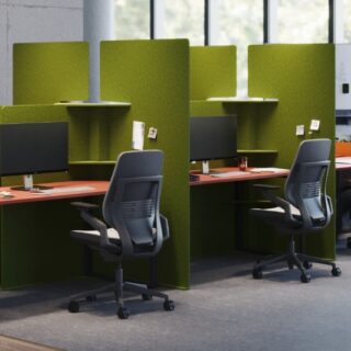 Green Soundproof office dividers with shelves and storage options, providing privacy and organization in a shared workspace