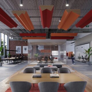A suspended Ezobord Summit baffle system in a vibrant color palette, installed in a modern office space with exposed brick walls and glass partitions.